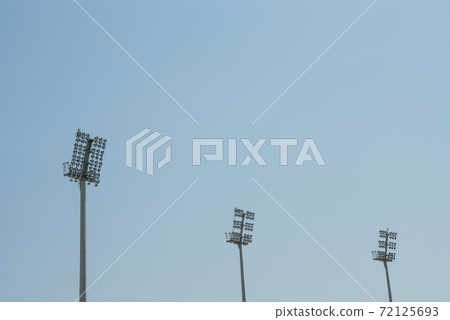A Stadium light pole in the sky. A Stadium light pole in the sky. 72125693