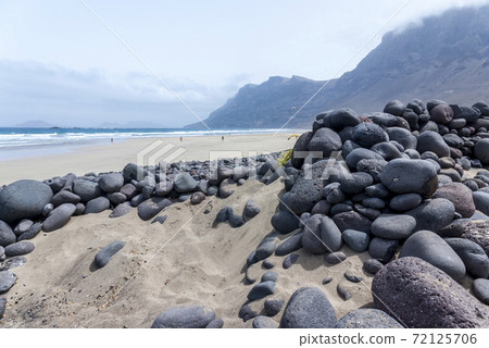 Sea landscape which was created on the famous Famara beach in Lanzarote 72125706