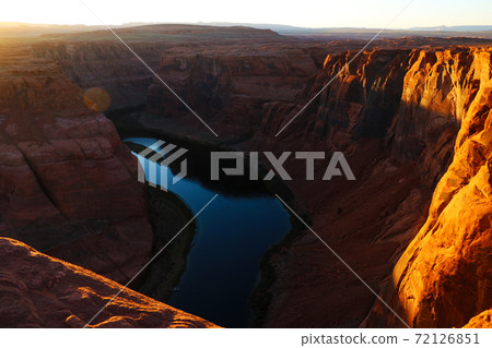 Beautiful view of the Horseshoe Bend, Arizona, under warm sunset light. Beautiful view of the Horseshoe Bend, Arizona, under warm sunset light. 72126851