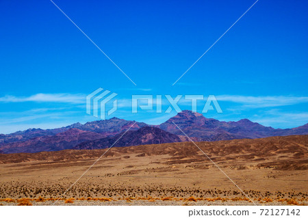 Different layers of Death Valley National Park with colorful mountains and sand dunes, USA. 72127142