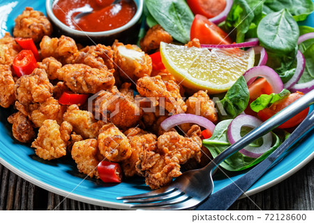 Popcorn chicken with ketchup and salad, close-up Popcorn chicken with ketchup and salad, close-up 72128600