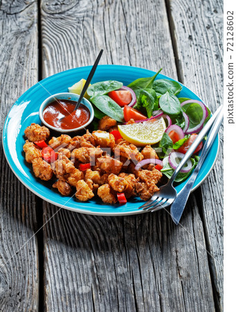 Popcorn chicken with ketchup and salad, close-up Popcorn chicken with ketchup and salad, close-up 72128602