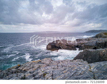 Dramatic sky above the coastline at Dawros in County Donegal - Ireland Dramatic sky above the coastline at Dawros in County Donegal - Ireland 72128899