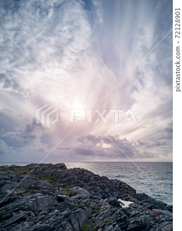 Dramatic sky above the coastline at Dawros in County Donegal - Ireland 72128901
