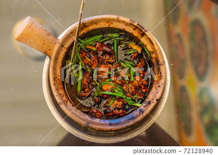 Singapore braised frog and spring onion in clay pot Singapore braised frog and spring onion in clay pot 72128940