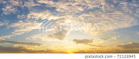 Golden fluffy cloud sky nature panorama background Golden fluffy cloud sky nature panorama background 72128945
