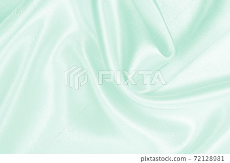 Smooth elegant green silk or satin luxury cloth texture as abstract background. Luxurious background design Smooth elegant green silk or satin luxury cloth texture as abstract background. Luxurious background design 72128981