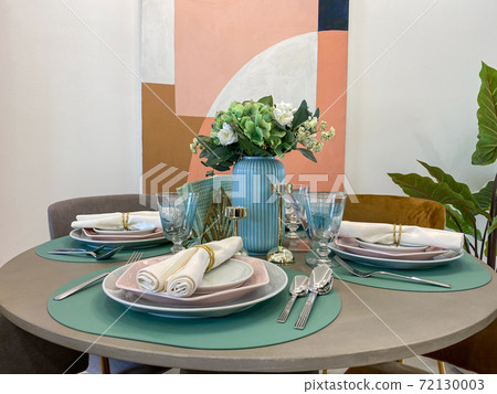 Modern interior design of dining table with cozy decoration Modern interior design of dining table with cozy decoration 72130003