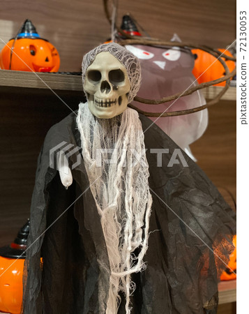 Vertical photo of scary death skeleton Halloween costume Vertical photo of scary death skeleton Halloween costume 72130053
