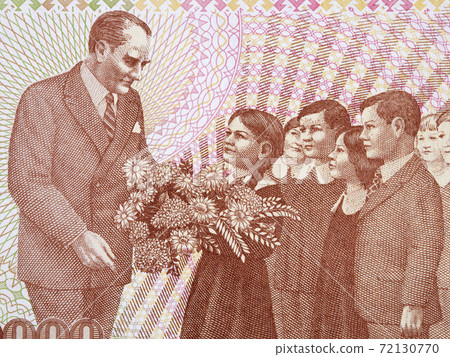 Mustafa Kemal Ataturk with a children a portrait from Turkish money 72130770
