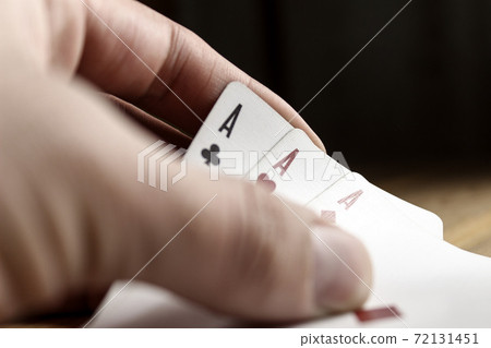 Playing cards in hand close-up. Poker. Playing cards in hand close-up. Poker. 72131451