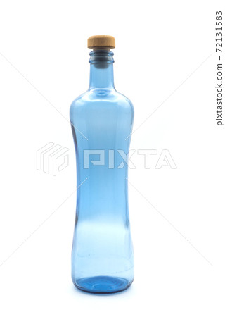 Closeup of blue glass bottle on white background Closeup of blue glass bottle on white background 72131583