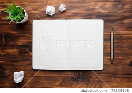 Diary open on a wooden table copy space Diary open on a wooden table copy space 72134508