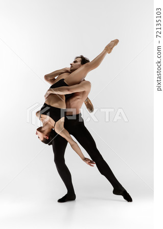 Young and graceful ballet dancers in minimal black style isolated on white studio background Young and graceful ballet dancers in minimal black style isolated on white studio background 72135103