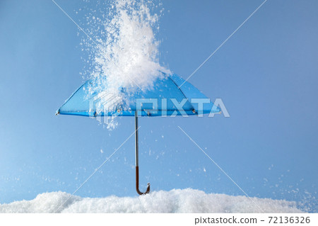 Blue umbrella on blue background with snow. Blue monday concept. Blue umbrella on blue background with snow. Blue monday concept. 72136326