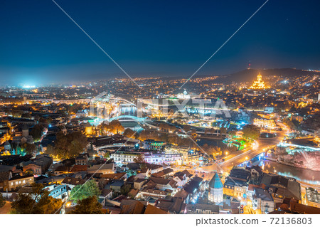 Tbilisi, Georgia. Elevated Rooftop View Of Famous Landmarks In Night Illuminations. Georgian Capital Skyline Cityscape Tbilisi, Georgia. Elevated Rooftop View Of Famous Landmarks In Night Illuminations. Georgian Capital Skyline Cityscape 72136803