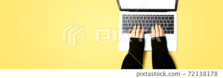 Person using a laptop computer Person using a laptop computer 72138178