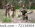 Old Man is Aiming Excited Young Hunters Watching. 72138904