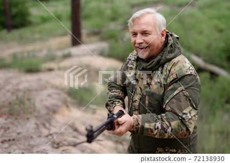 Happy Hunter Walks with Shotgun Lifestyle Concept. 72138930