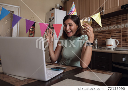 Girl celebrating birthday online in quarantine time. 72138990