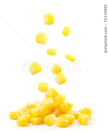 Canned corn falls on a heap on a white background 72138993