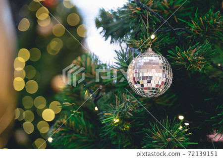 Decorated Christmas tree on blurred background. 72139151