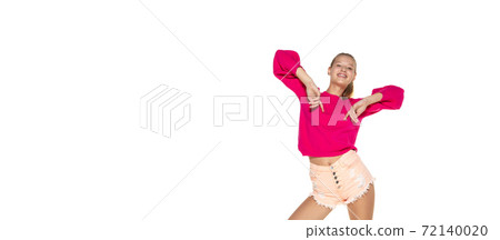 Cheerful female model in casual bright wear isolated on white background. 72140020