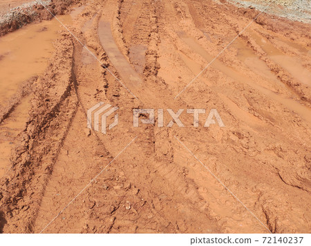 The mark of heavy vehicle tires that have gone through a muddy soil. The mark of heavy vehicle tires that have gone through a muddy soil. 72140237