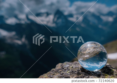 beautiful spherical glass ball with majestic Caucasian mountains 72140620