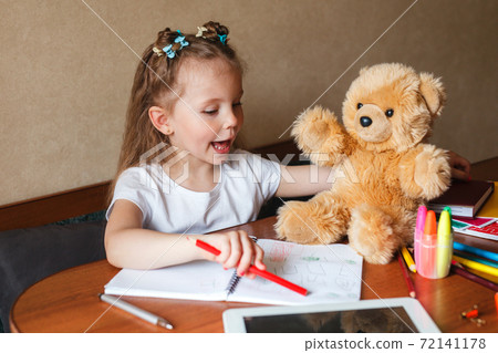 Cute little preschooler child playing and drawing at home Cute little preschooler child playing and drawing at home 72141178
