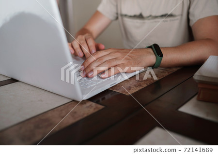 Portrait of handsome young man working in home office, copy space Portrait of handsome young man working in home office, copy space 72141689