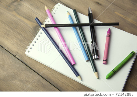 notebook, pencils and pen on table notebook, pencils and pen on table 72142893