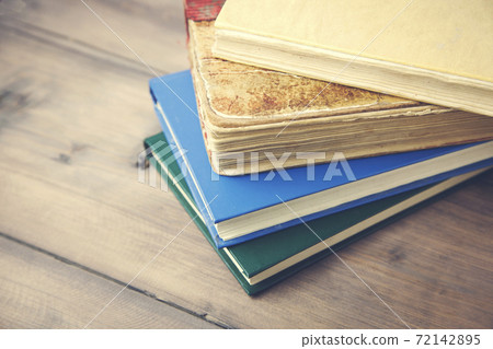 Bunch of books on table Bunch of books on table 72142895