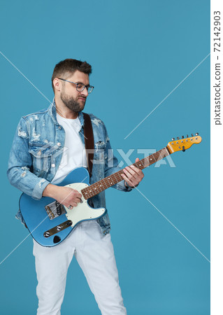 handsome man in denim with guitar handsome man in denim with guitar 72142903