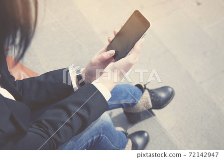 woman hand phone woman hand phone 72142947