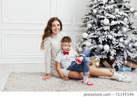 Mom and boy decorates Christmas decoration Christmas Christmas Christmas New Year Mom and boy decorates Christmas decoration Christmas Christmas Christmas New Year 72145546