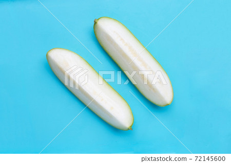 Winter melon on blue background. Winter melon on blue background. 72145600