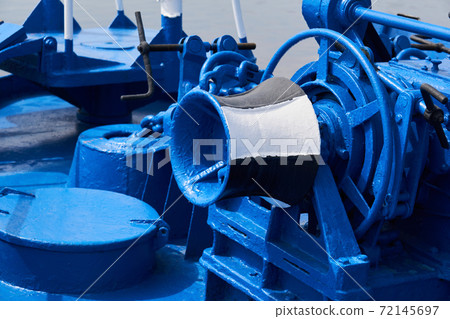 capstan and other mechanisms, painted blue, on the foredeck of the ship, close-up 72145697