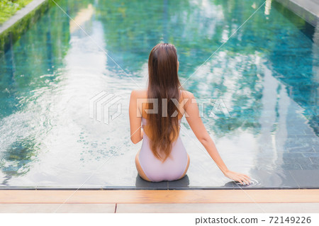 Portrait beautiful young asian woman relax smile leisure around outdoor swimming pool 72149226