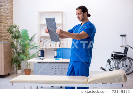 Young male doctor radiologist working in the clinic 72149333