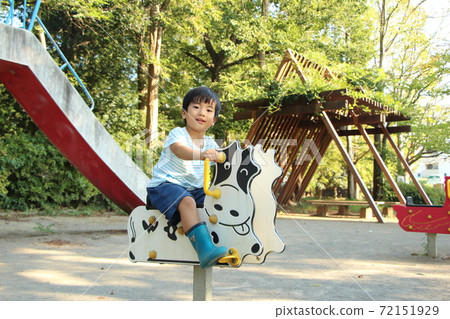 A boy playing in a park 72151929