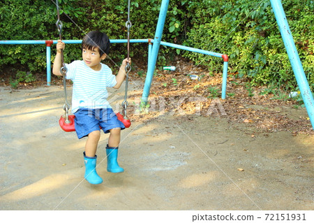 A boy playing in a park 72151931