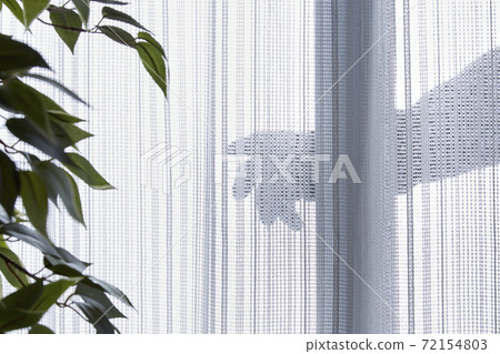 A scene of a thief invading through a burglary window 72154803
