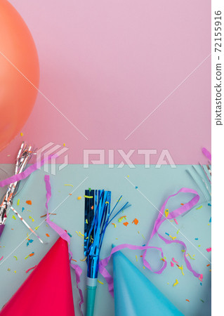 Happy birthday candles with confetti and party streamers on blue and yellow 72155916