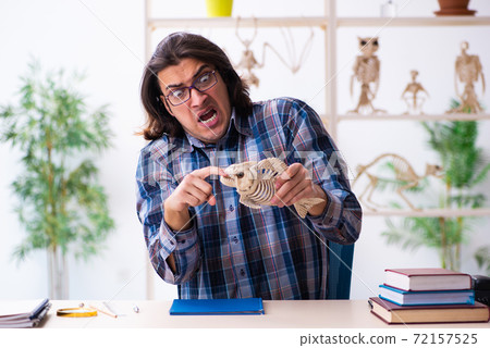 Young male teacher paleontologist in the classroom Young male teacher paleontologist in the classroom 72157525
