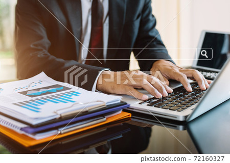 Male business clicking internet search page on computer touch screen in office. 72160327