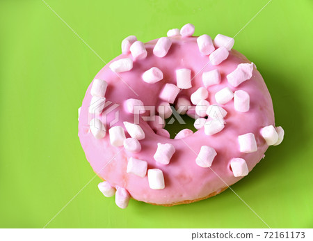Strawberry donut covered with pink icing Strawberry donut covered with pink icing 72161173