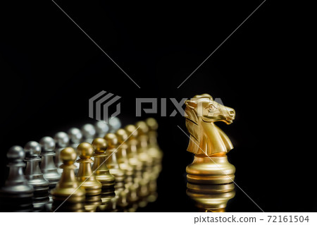Golden chess knight pieces playing game and strategy. Concept of leadership and success 72161504