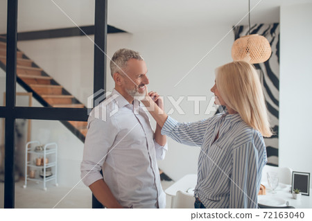 Happy couple looking at each other and smiling nicely 72163040