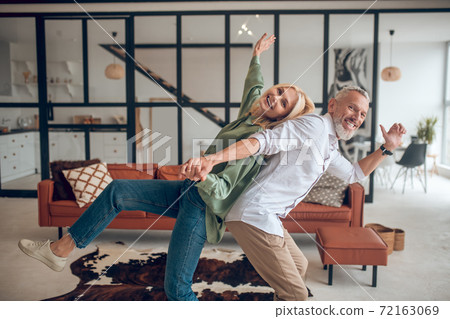 Man and woman spending weekend at home and feeling energized 72163069